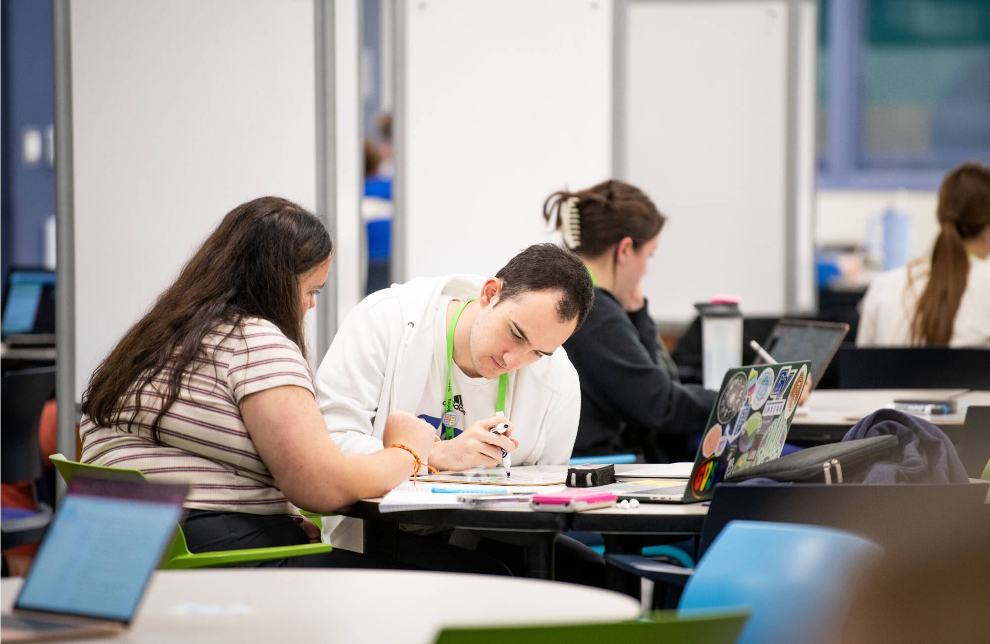 Pablo Kohlmann Garcia, right, tutors Tara Barnett, left, in the new Tutoring and Reading Center in Henry Hall September 27.(Photo releases on file)